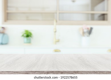 empty table board and defocused modern kitchen background. product display concept - Shutterstock ID 1922578655