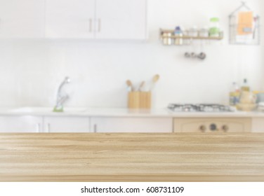 empty table board and defocused modern kitchen background. product display and picnic concept - Shutterstock ID 608731109