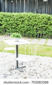 empty table and chair in the garden