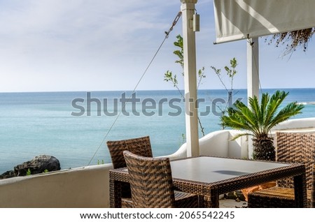 Empty table with chairs with the Seaview