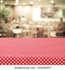 Empty Table Covered With Red Check Tablecloth Over Blurred Restaurant With Bokeh Light Background, Product, Food Display Template 