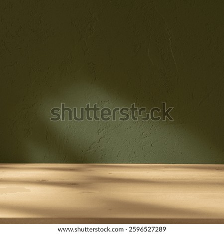 Empty table and darkgreen wall. Table with sun reflections and leaves shadows on beige wall. Background with bokeh for product presentation.Mock up for presentation, branding products, cosmetics food 