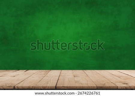 Empty table and darkgreen wall. Table with sun reflections and leaves shadows on beige wall. Background with bokeh for product presentation.Mock up for presentation, branding products, cosmetics food 