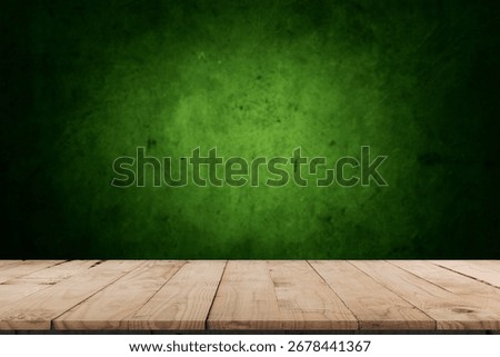 Empty table and darkgreen wall. Table with sun reflections and leaves shadows on beige wall. Background with bokeh for product presentation.Mock up for presentation, branding products, cosmetics food 