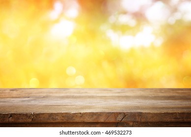 Empty table in front of blurry autumn background. Ready for product display montage - Powered by Shutterstock