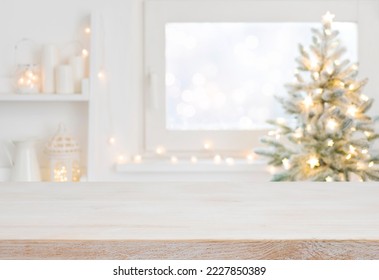 Empty table in front of christmas tree with decoration background - Powered by Shutterstock