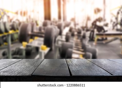 Empty Table Montage With Blur Fitness Gym Room On Background.