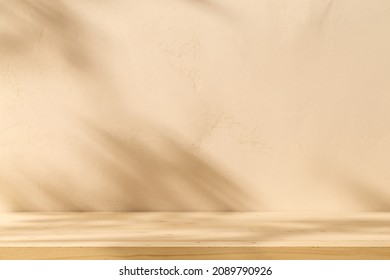 Empty table on beige texture wall background. Composition with leaves shadow on the wall. Mock up for presentation, branding products, cosmetics, food or jewellery.
 - Shutterstock ID 2089790926