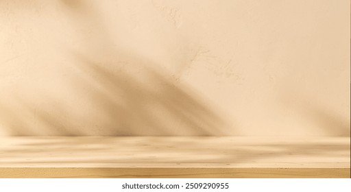 Empty table on beige texture wall background. Composition with monstera leaves shadow on the wall. Mock up for presentation, branding products, cosmetics food or jewellery.
