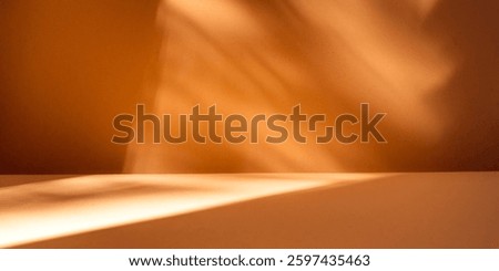 Empty table on beige wall. Minimalist background with window shadow on wall. Mock up for presentation, branding products, cosmetics, food or jewelry. 