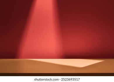 Empty table on dark red wall. Background with window light and geometric shadow. Mockup for presentation, branding products, cosmetics, technology or jewelry. Minimal, elegant, holiday background