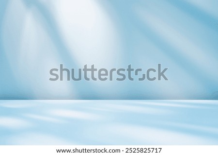 Empty table on smooth blue wall background. Composition with abstract light reflections and shadows. Stylish, beautiful, elegant mockup for winter presentation, branding products, cosmetics and food.