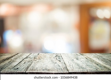 Empty Table For Present Product With Blured Background Of Coffee Cafe.