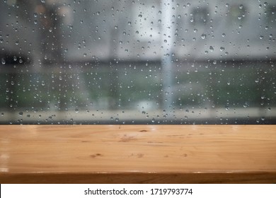 Empty Table With Rainy Window