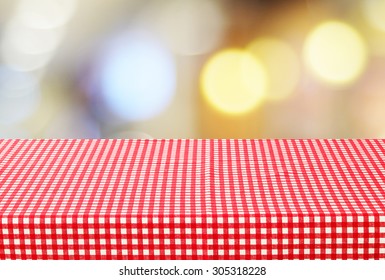 Empty Table With Red Check Tablecloth Over Blur Festive Bokeh Background, Product Display