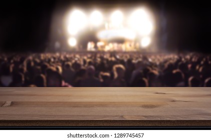 Empty Table Top For Product Display Montage. Crowd At Concert, Summer Music Festival Blurred In The Background.