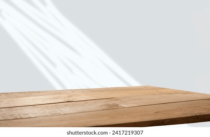 empty table with window shadow on light wall background for product mockup display. kitchen interior theme