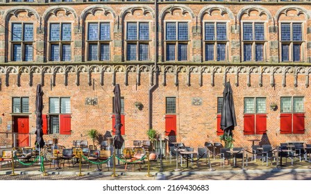 Empty tables and chairs at the historic weigh house in Deventer, Netherlands