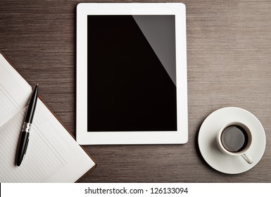 Empty Tablet And A Cup Of Coffee On The Desk