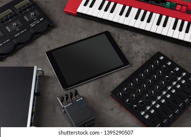 Empty tablet and electronic music instruments 