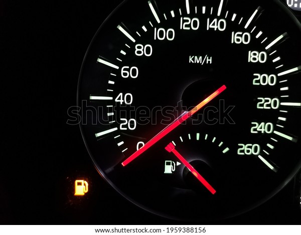 Empty tank. Speedometer with an arrow at zero.\
The fuel has run out. Crisis. A car does not go. Speed 0. Vehicle\
dashboard. Dial with a red arrow. Illuminated night device. Urgent\
refueling is needed.