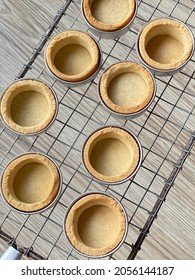 Empty Tart Shells Cooling On A Wire Rack