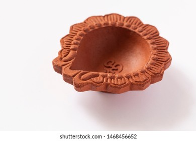 Empty Terracotta Oil Lamp On White Background.