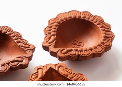 Empty Terracotta Oil Lamp On White Background.