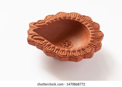 Empty Terracotta Oil Lamp On White Background.