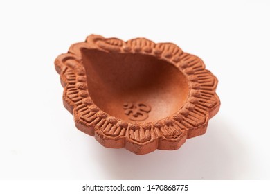 Empty Terracotta Oil Lamp On White Background.