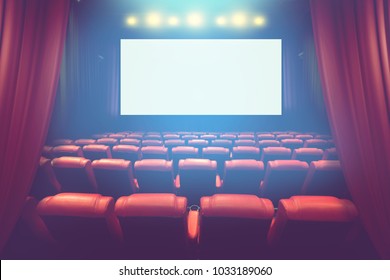 empty theater auditorium with blank screen or movie cinema with red seats before show time