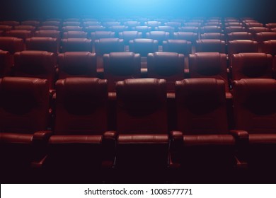 Empty Theater Auditorium Or Movie Cinema With Red Seats And Blue Light From Behind