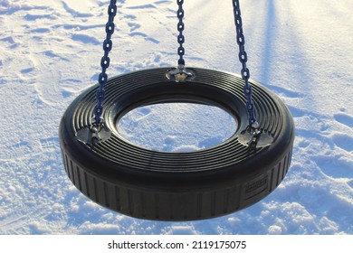 Am Empty Tire Swing On N The Snow.