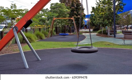 Empty Tire Swing In A Park. Tyre Swing In A Park. Kid's Park In Australia. Children's Park In Australia.
					