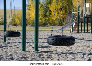 Empty Tire Swing Set In Fall