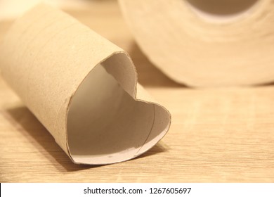 An Empty Toilet Paper Roll In A Shape Of Heart