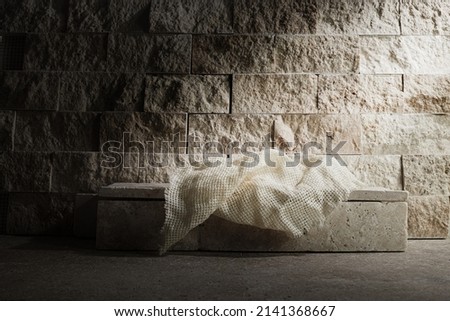 Empty tomb while light shines from the outside. Jesus Christ Resurrection. Christian Easter concept.