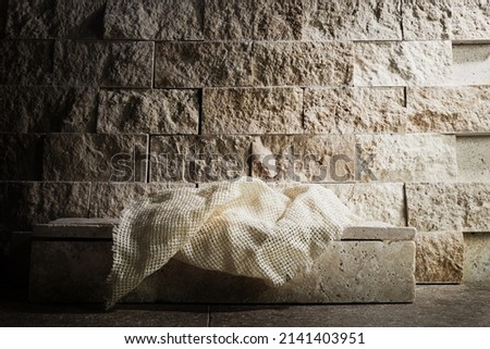 Empty tomb while light shines from the outside. Jesus Christ Resurrection. Christian Easter concept.