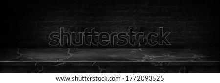 Empty top of natural stone shelves and cement wall background. Empty marble black table top cement black.