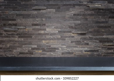 Empty Top Of Natural Stone Table And Stone Wall Background. For Product Display