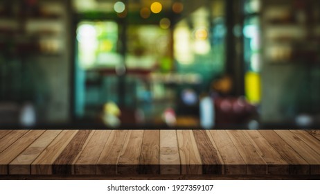 Empty Top Of Wood Table With Blur Cafe Or Coffee Shop Background.