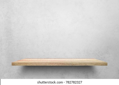 Empty top wooden shelves with grunge cement or concrete wall texture background.Counter for display or montage of product.