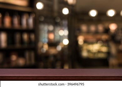Empty Top Of Wooden Table Or Counter On Cafeteria, Bar, Coffeeshop Background. For Product Display