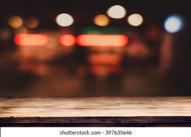 Empty top of wooden table or counter on cafeteria, bar, coffeeshop background. For product display - Shutterstock ID 397635646
