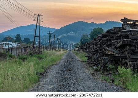 The empty trackbed along the modernized Railway Line No. 104 between Chabówka and Nowy Sącz, near Limanowa, Poland