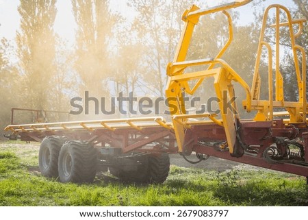 Empty tractor trailer after stransporting stacked hay bales