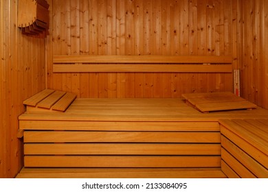 Empty traditional finnish sauna interior. Wooden bench in sauna room for relaxation. Healthcare lifestyle.
