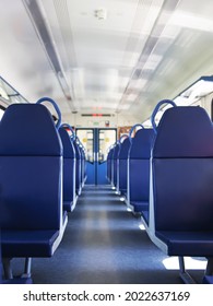 An Empty Train Car With New Blue Leather Seats