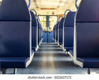 An Empty Train Car With New Blue Leather Seats