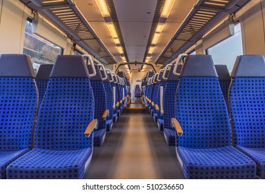 Empty Train Chairs - Image With The Interior Of A German Modern Train, With No People On The Blue Chairs